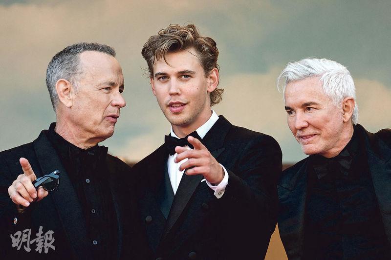 湯漢斯（左起）、奧斯汀畢拿跟《貓王》導演巴兹雷曼在首映禮聊得興起。（法新社）