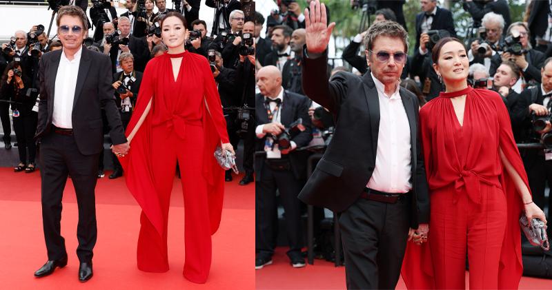 一身紅衣打扮的鞏俐開幕禮時獨自現身，在《奪寶奇兵之命運輪盤》首映終於與丈夫Jean-Michel Jarre結伴。（法新社/Getty Images）